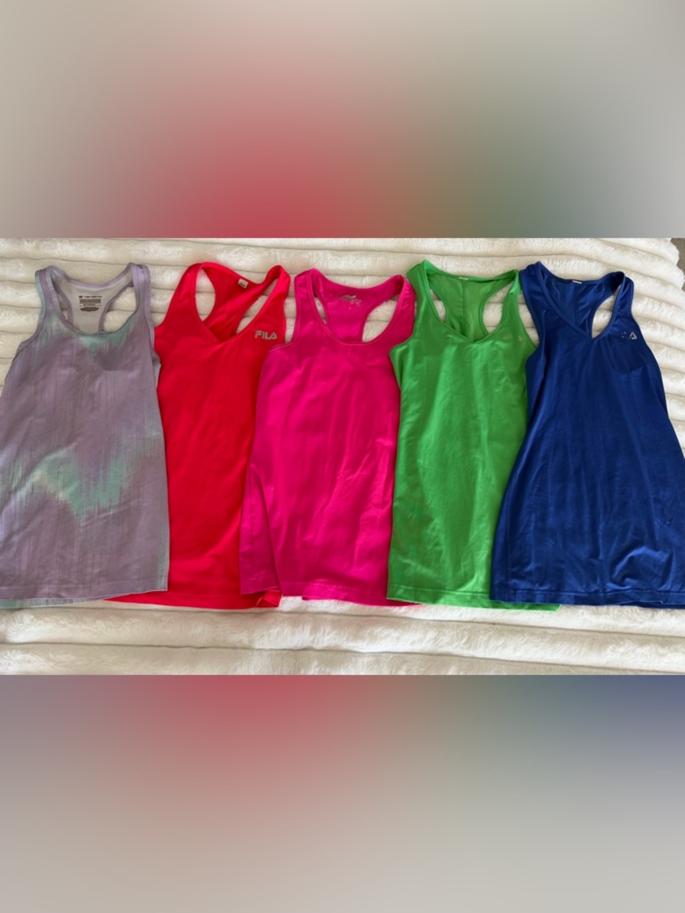 Bundle of 13 women’s workout tank tops (sizes XS and SM)
